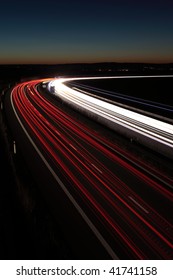 Night highway (Cars in a rush moving fast on a highway  (speedway) in the UK at the nightfall - Shutterstock ID 41741158