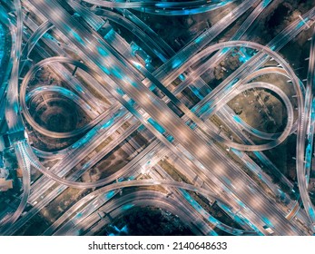 Night Hyper Lapse, speed motion of traffic transportation at the roundabout street road, City and connection technology, futuristic abstract background for financial technology and business innovation
