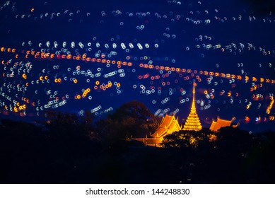 night landscape of Doi Suthep Chiang Mai, Thailand. with doughnut shape Bokeh background. from reflect lens.