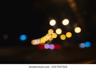 
Night life image, night city lights. Blurred at street lights, abstract retro style blurred bokeh background.