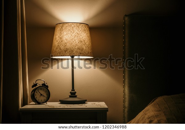 Night Light Alarm Clock On Bedside Stock Photo Edit Now 1202346988