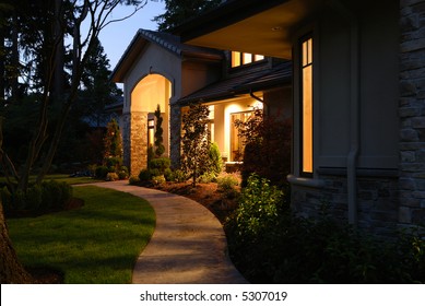 Night Light In Front Of A Large House