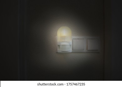 Night Light Plug In White Socket On White Wall Turns On Automatically In Modern House Led Light By Night In The Dark