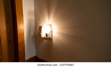 Night Light Plugged Into A Wall In A House