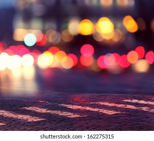 Night Lights In City And Zebra Crossing On Pavement