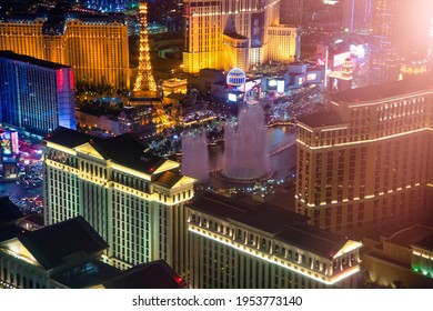 Night lights in The Strip, Las Vegas. Aerial view of most famous city casinos from helicopter, Nevada - USA