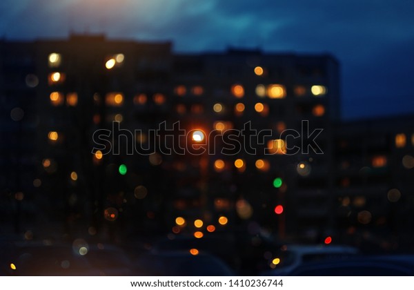 night lights windows\
houses blurred background. City night lights. view of town houses\
with night lights. 