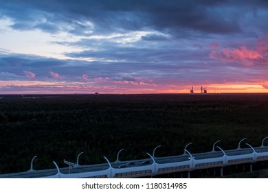 Night Lights,colorful Sunset Background.Silhouette Oil Refinery And Petrochemical Plant At Dusk At Sunrise. Industrial Zone And Teil Of High Speed Street.Copy Space