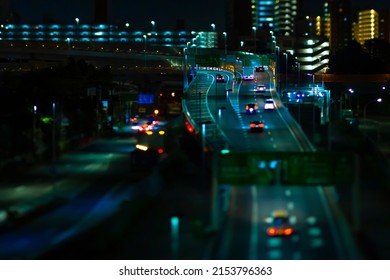 A Night Miniature Traffic Jam At The Urban Street In Tokyo. High Quality Photo. Shinagawa District Tokyo Japan 04.22.2022 Here Is Highway Side In Tokyo. Translation On Billboards Text Area Name.