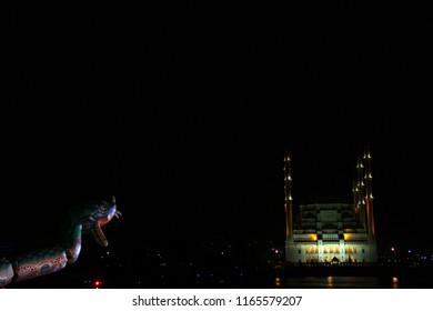 night mosque reflection