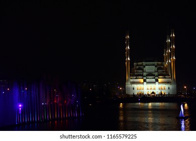 night mosque reflection