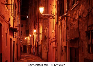 Night narrow street with vinatge lanterns, Sanremo, Italy