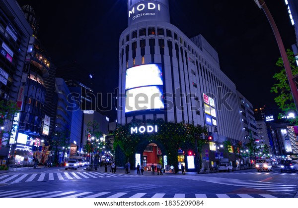 A night neon town in\
Shibuya Tokyo wide shot. Shibuya district Shibuya Tokyo / Japan -\
10.06.2020