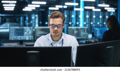Night Office: Young Caucasian Man Working on Two Desktop Computers. Digital Entrepreneur Typing Code, Creating Modern Software, e-Commerce App Design, e-Business Programming