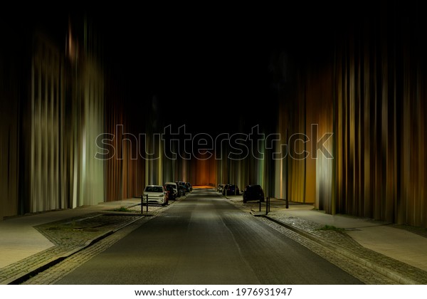 At night on the\
street,Subsequently creatively worked distorted houses, cars park\
on the side of the road