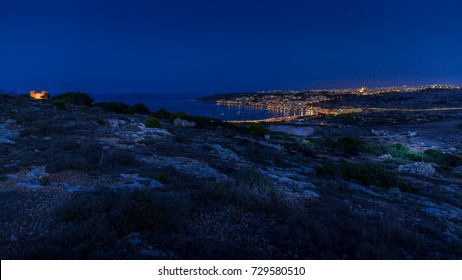 Night Over Mellieha Bay With St. Agathas Tower (red Tower) On The Left