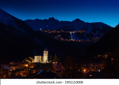 Night Panorama Of Champagny-en-Vanoise Over Courchevel Valley And Ski Resort With Alps Mountain Peaks View From