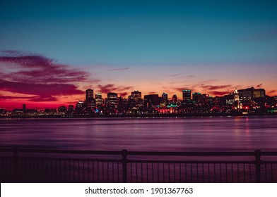 Night panorama of the city of Montreal with the St. Lawrence River, sunset in December