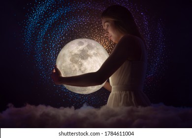 Night photo of a beautiful girl hug the moon, tender photo, astrology and zodiac - Shutterstock ID 1784611004