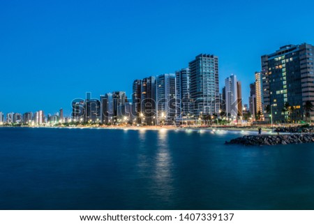 Night photo of the coast of Fortaleza - Ceará - Brazil. Iracema Beach. Lots of buildings.