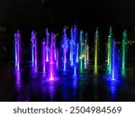 Night photo of colorful singing floor fountains in Plovdiv, Bulgaria