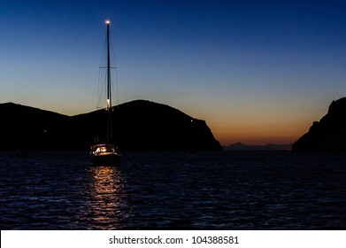 Night photo of sailing boat at anchor. Isle de Cabrera, Spain - Powered by Shutterstock