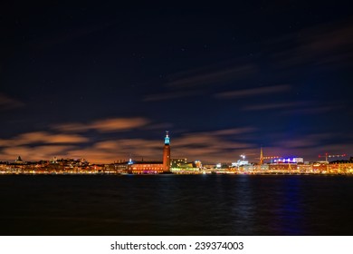Night photography of the city center with the town hall in Stockholm, clear sky with stars, Sweden 