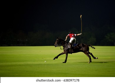 At Night Polo player and horse playing in games. - Powered by Shutterstock