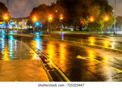 Night Rain View Yellow Traffic Lights At UK Roundabout