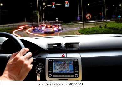 Night riding in street traffic  with gps map