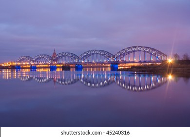 Night river with bridge and reflection
