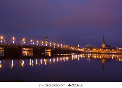 Night river with bridge and reflection