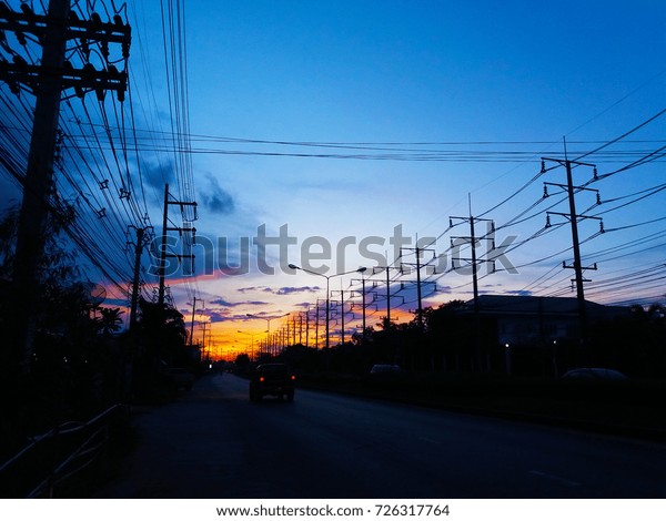 Night road with electric\
poles