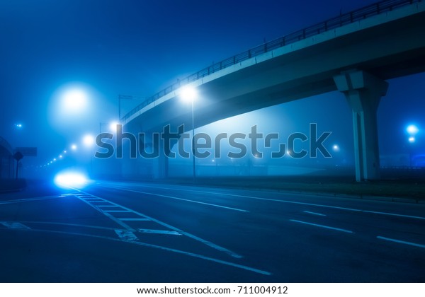 Night road in the
fog. Highway. Dense fog.