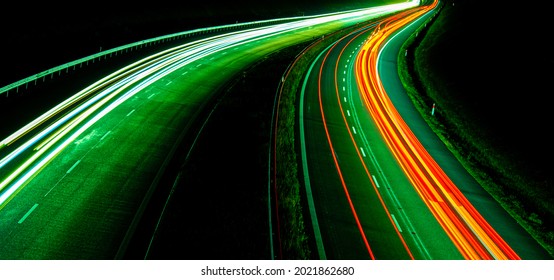 Night road lights. Lights of moving cars at night. long exposure red, blue, green, orange.