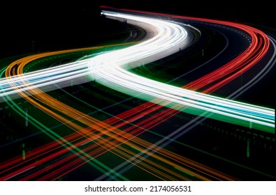 Night road lights. Lights of moving cars at night. long exposure red, blue, green, orange. - Shutterstock ID 2174056531