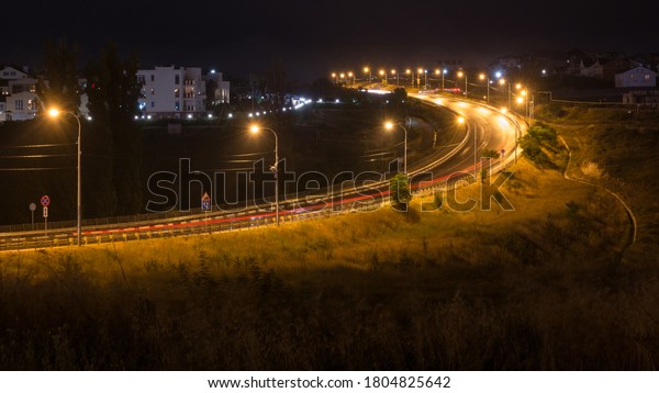night road,\
street, lamp posts, long\
exposure