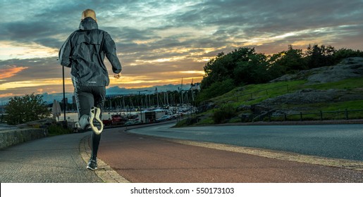 Night Runner, Caucasian Male In City Park At Sunset