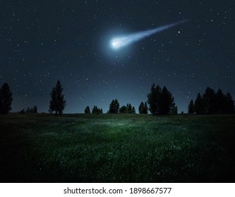 Night scene with a comet, asteroid, meteorite flying to Earth. Night landscape. Elements of this image furnished by NASA.  - Shutterstock ID 1898667577