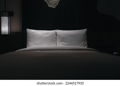 Night scene in hotel room, nightstand with lamp - Shutterstock ID 2244317933