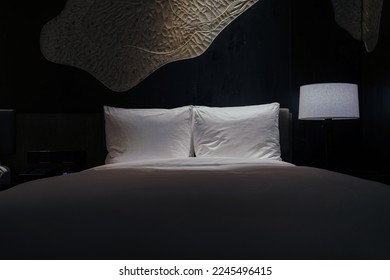 Night scene in hotel room, nightstand with lamp - Shutterstock ID 2245496415