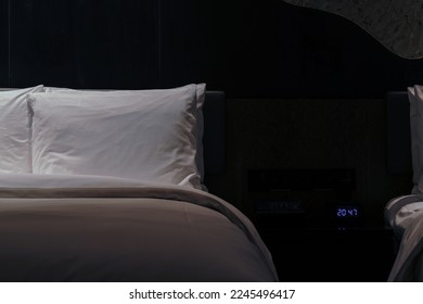 Night scene in hotel room, nightstand with lamp - Shutterstock ID 2245496417