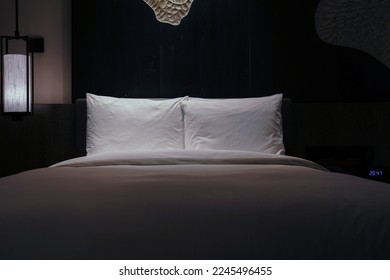 Night scene in hotel room, nightstand with lamp - Shutterstock ID 2245496455
