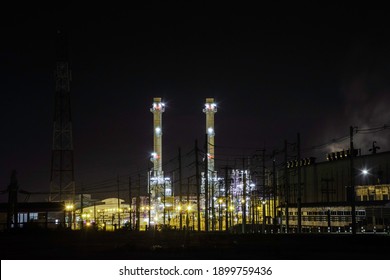 Night Scene Of Industry Factory Plant With Modern Warehouse, Environmentally Friendly Manufacturing Plant Of New Technology Production Line