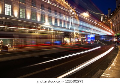 Night Scene Of London City United Kingdom With The Moving Red Buses And Cars - Long Exposure Photography