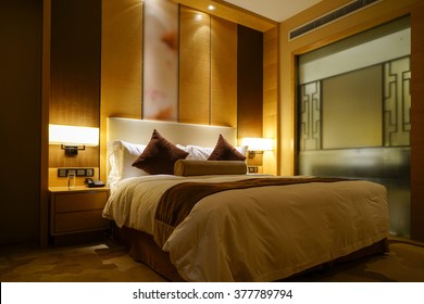 Night Scene In Luxury Hotel Room, Nightstand With Lamp.