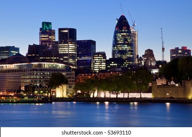 night scene of modern London city skyline of business district along River Thames near the Tower Bridge