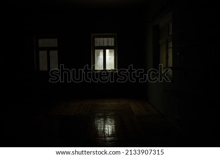 Night scene of moon seen through the window from dark room. Realistic dollhouse miniature decorated. Moonlight inside dark room