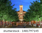 Night scene in Place de Marche, Carouge, Geneva, Switzerland with the Church of Sainte-Croix overlooking the square.