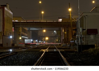 Night Scene Of Train Tracks In The Rain.